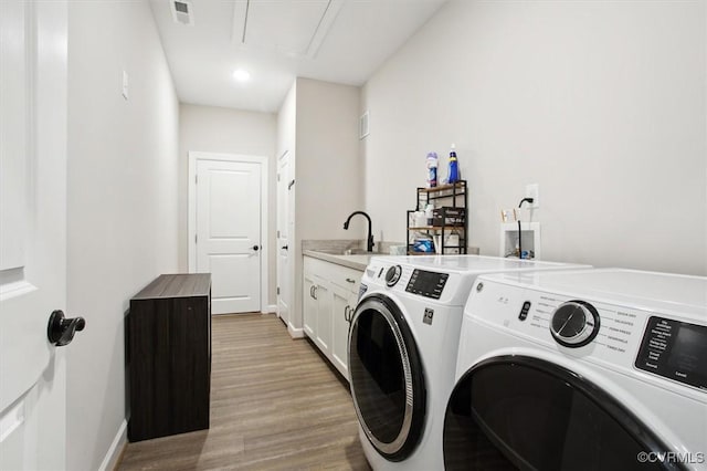 5080 Brandon Pines Way, Providence Forge, VA 23140 - laundry room with cabinet space, visible vents, a sink, and separate washer and dryer