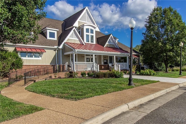 5080 Brandon Pines Way, Providence Forge, VA 23140 - craftsman inspired home with covered porch, a standing seam roof, metal roof, roof with shingles, and a front yard