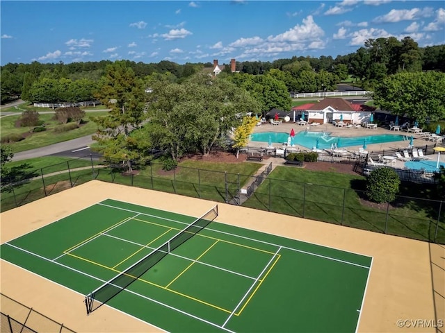 5080 Brandon Pines Way, Providence Forge, VA 23140 - view of tennis court featuring a community pool, a lawn, and fence