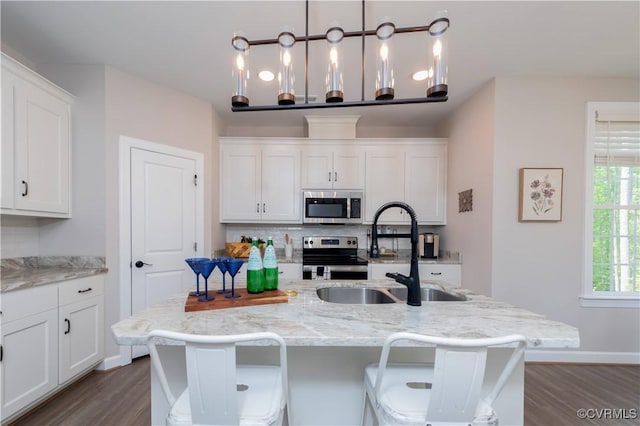 5080 Brandon Pines Way, Providence Forge, VA 23140 - kitchen featuring a sink, white cabinets, a center island with sink, dark wood finished floors, and appliances with stainless steel finishes