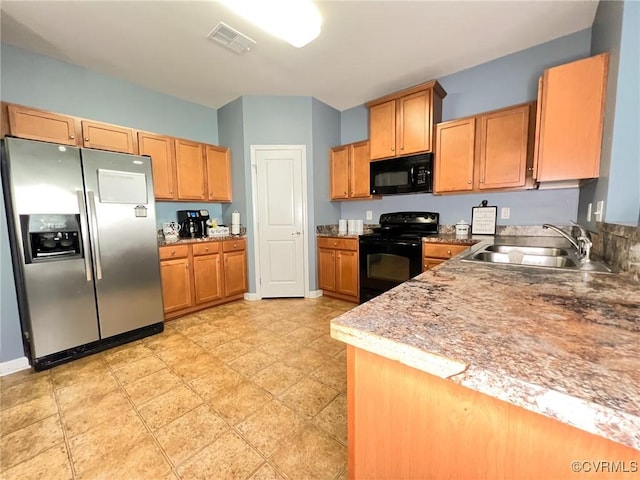 kitchen featuring black appliances and sink