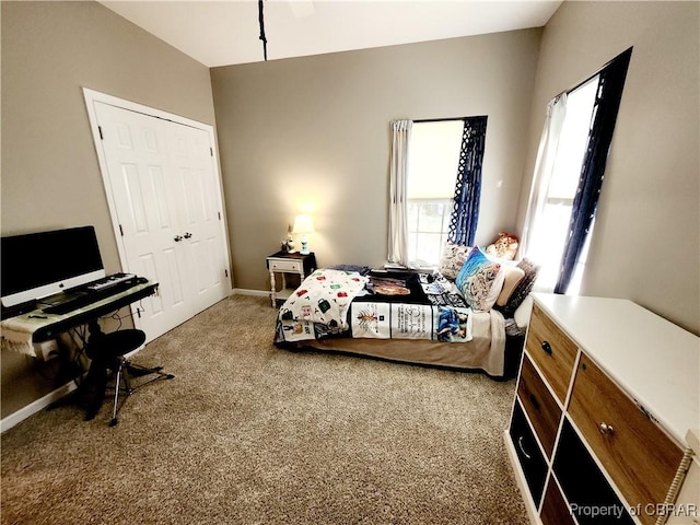 bedroom with carpet flooring and a closet