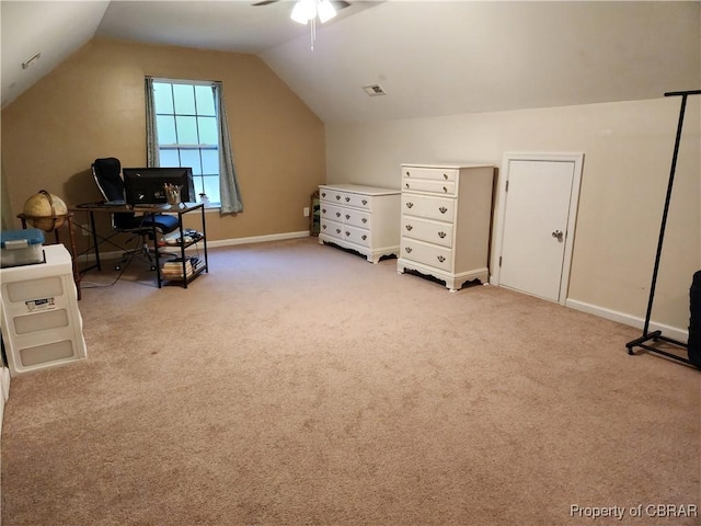 interior space with light colored carpet, vaulted ceiling, and ceiling fan