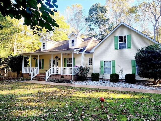 view of front of property with a porch and a front yard