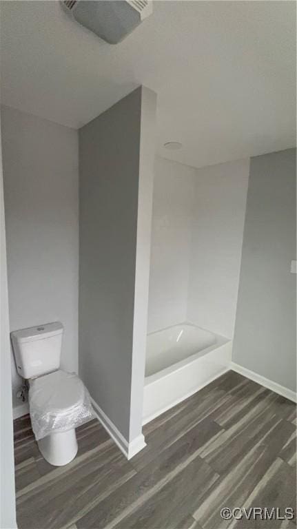 bathroom with wood-type flooring and toilet