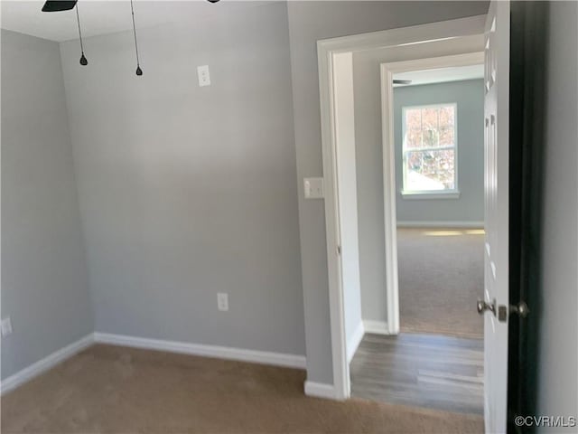 spare room featuring light colored carpet