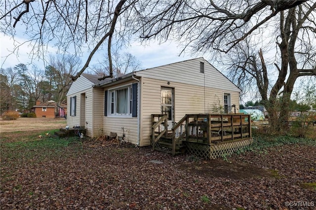 rear view of house with a deck