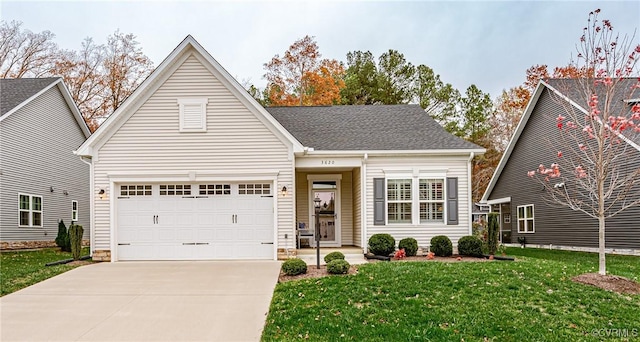 view of front of house featuring a front yard and a garage