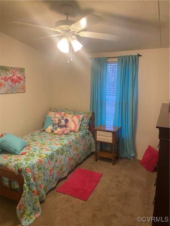 bedroom featuring carpet floors and ceiling fan