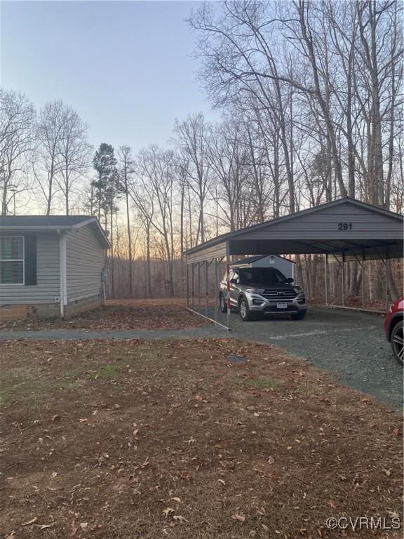 yard at dusk with a carport