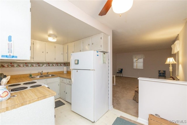 kitchen featuring ceiling fan, white cabinetry, white appliances, and sink