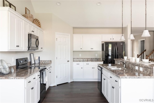 kitchen featuring light stone counters, sink, black appliances, pendant lighting, and white cabinetry