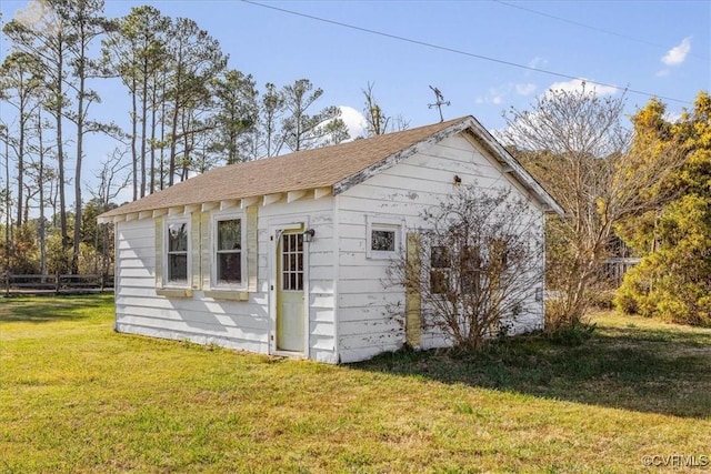 view of outdoor structure with a yard