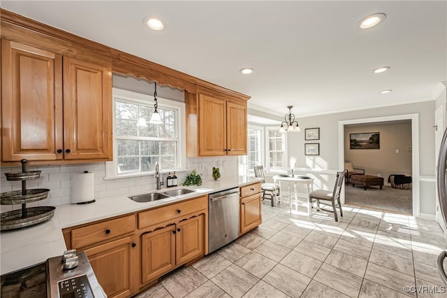 kitchen with sink, pendant lighting, stainless steel dishwasher, and tasteful backsplash