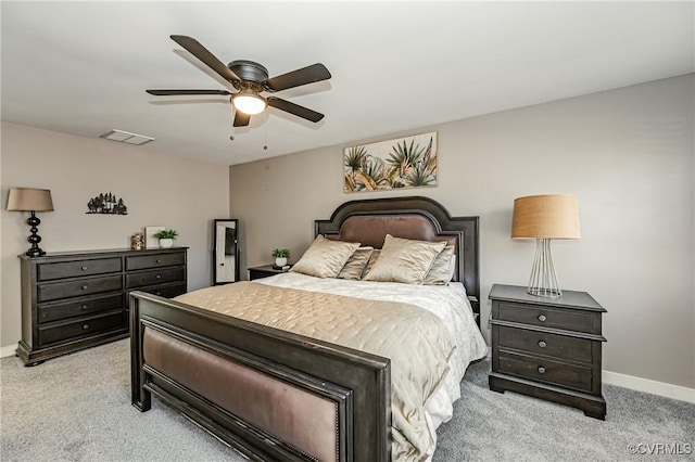 bedroom with ceiling fan and light colored carpet