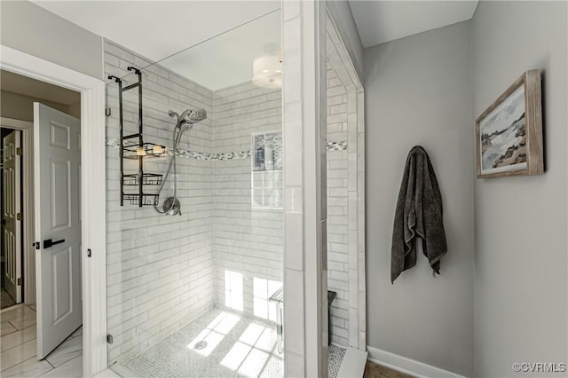 bathroom featuring a tile shower