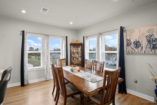 dining area with light hardwood / wood-style flooring