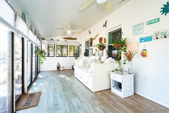 sunroom / solarium with ceiling fan