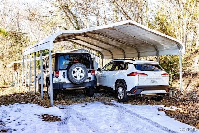 snow covered parking with a carport