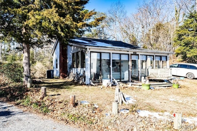 view of front of home with a sunroom