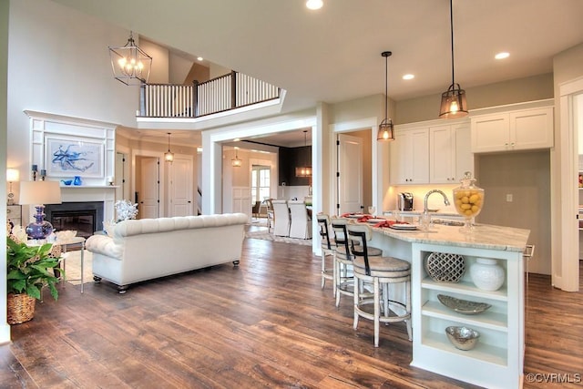 1509 Buford Rd, North Chesterfield, VA 23235 - living room featuring dark wood finished floors, recessed lighting, and a glass covered fireplace