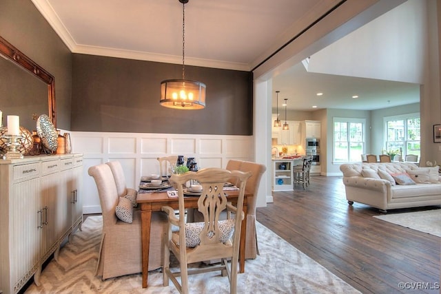 1509 Buford Rd, North Chesterfield, VA 23235 - dining space featuring a chandelier, light wood-style floors, a decorative wall, crown molding, and wainscoting
