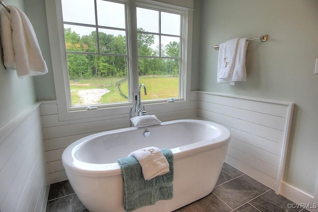1509 Buford Rd, North Chesterfield, VA 23235 - full bathroom featuring a soaking tub, plenty of natural light, wainscoting, and wood walls