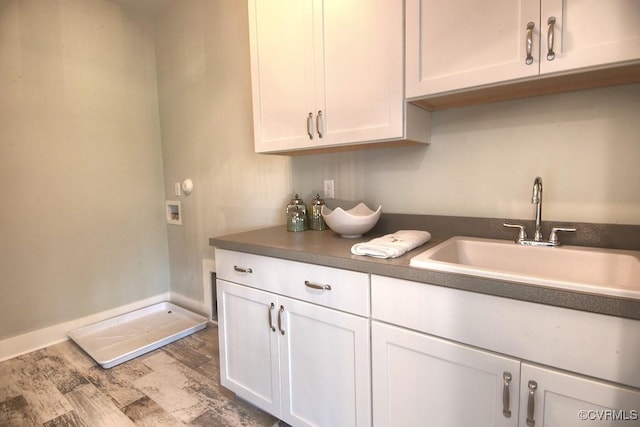 1509 Buford Rd, North Chesterfield, VA 23235 - kitchen featuring a sink, white cabinetry, wood finished floors, baseboards, and dark countertops