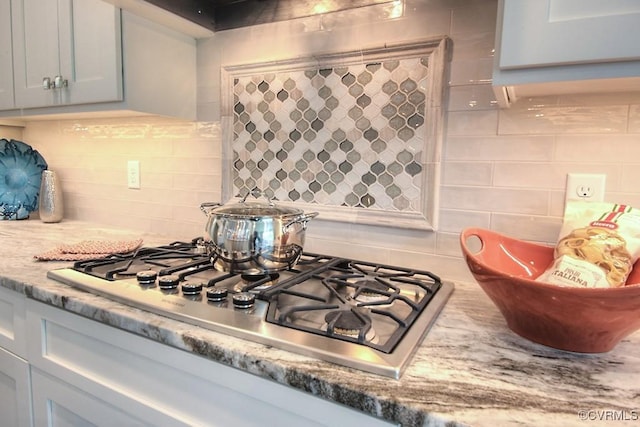 1509 Buford Rd, North Chesterfield, VA 23235 - kitchen view of stainless steel gas cooktop, backsplash, and light stone counters
