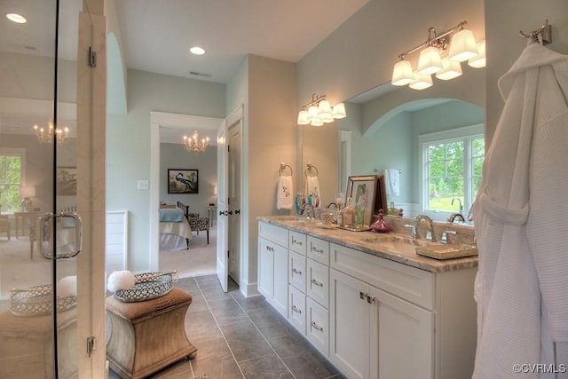 1509 Buford Rd, North Chesterfield, VA 23235 - full bathroom featuring a chandelier, connected bathroom, double vanity, a shower stall, and recessed lighting