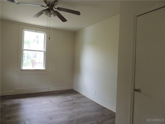 empty room with ceiling fan and wood-type flooring