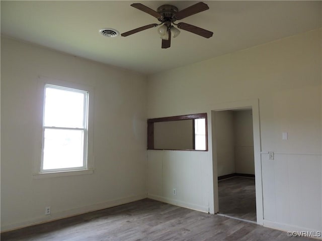 empty room featuring ceiling fan and light hardwood / wood-style floors