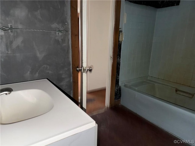 bathroom featuring  shower combination and sink