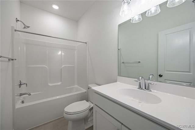 full bathroom featuring tile patterned flooring, vanity, toilet, and shower / bathtub combination