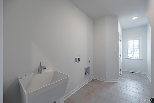 laundry room featuring hookup for an electric dryer, washer hookup, light tile patterned flooring, and sink