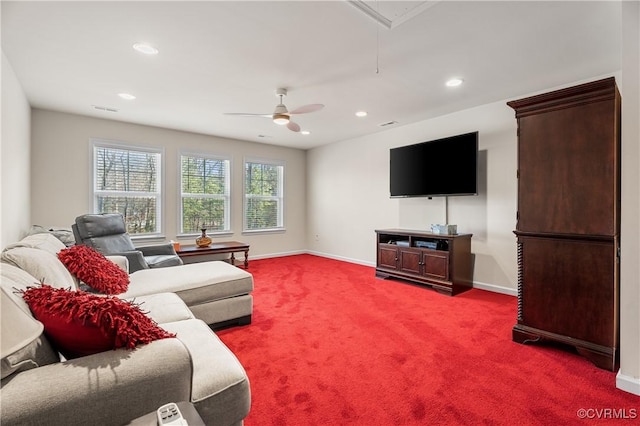 carpeted living room with ceiling fan