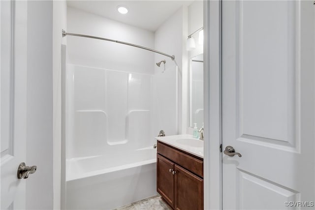 bathroom with vanity and washtub / shower combination