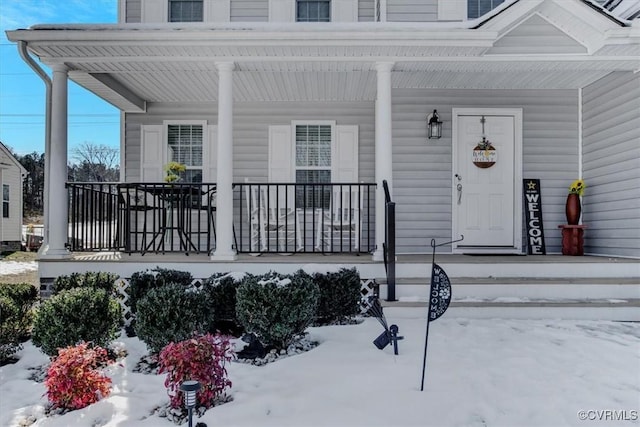 view of snow covered property entrance