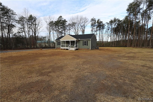 view of front facade with a porch and central AC