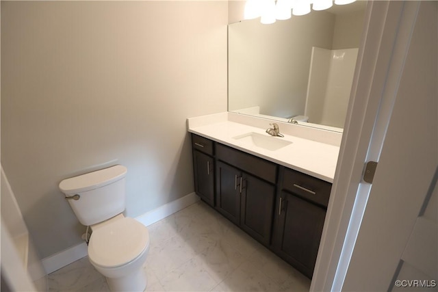 bathroom with vanity, toilet, and walk in shower