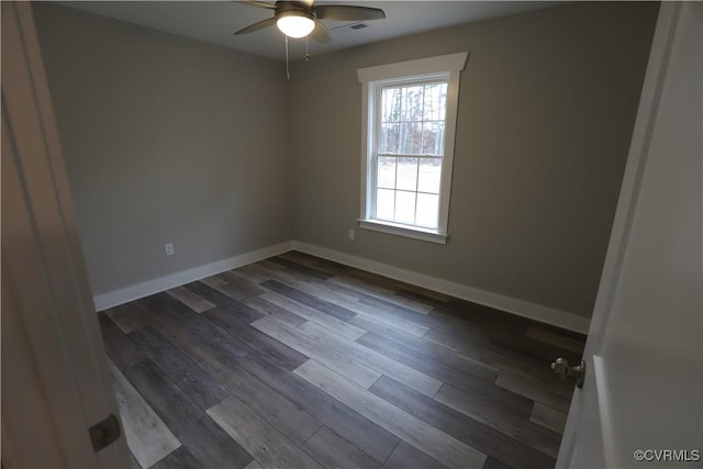 unfurnished room featuring dark hardwood / wood-style floors and ceiling fan