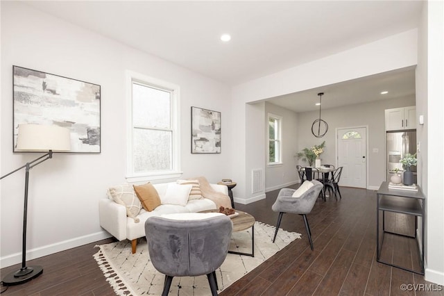 sitting room with dark hardwood / wood-style floors