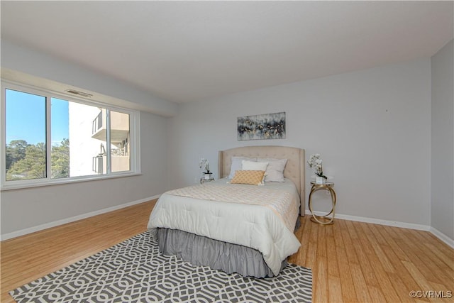 bedroom featuring wood-type flooring