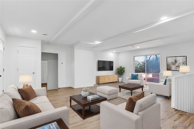 living room featuring beam ceiling and light wood-type flooring