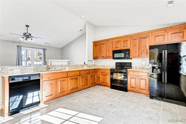 kitchen featuring ceiling fan, sink, kitchen peninsula, vaulted ceiling, and black appliances