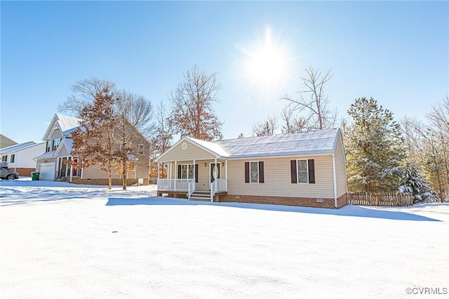 view of front of property featuring a porch and a garage