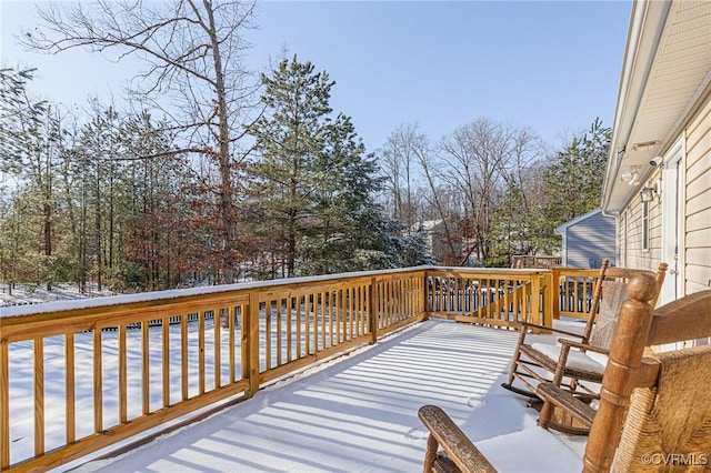 view of snow covered deck