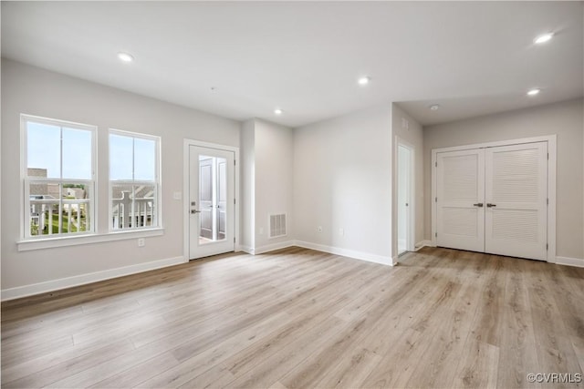 6725 Citory Way Unit 204, Moseley, VA 23120 - unfurnished living room featuring light wood-style floors, baseboards, and recessed lighting