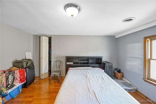 bedroom with hardwood / wood-style floors