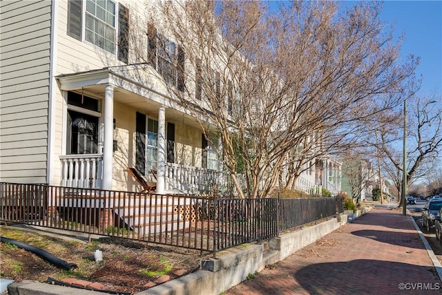 view of property exterior featuring a porch